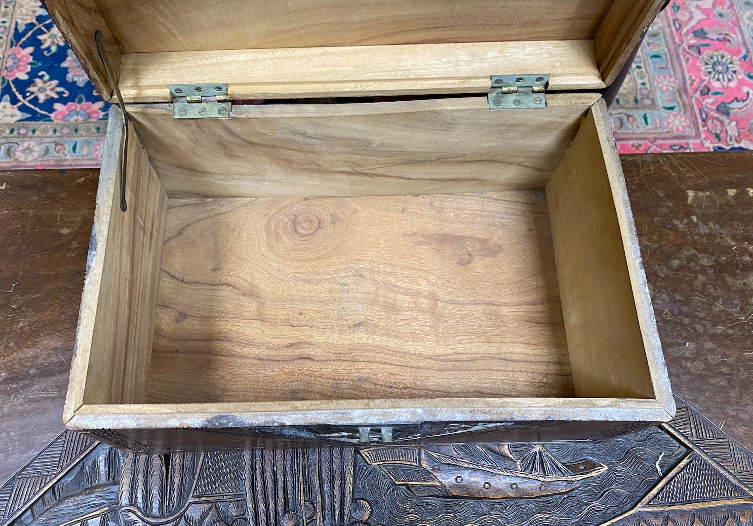 A Chinese carved camphorwood coffer and similar smaller box, larger length 93cm, depth 44cm, height 49cm